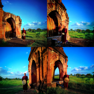 a monk in a deep crimson robe, holding a round fan, stands at the archway of an ancient red brick temple. the background features lush green fields and a blue sky dotted with scattered white clouds. the cinematic lighting, high detail, 8k resolution, symmetrical composition, soft light, wide-angle lens, long shot, natural light, tranquil atmosphere, soft tones, fine textures, zen-like ambiance, solemn expression, traditional attire, ancient architecture, blue sky and white clouds, and rural scenery.