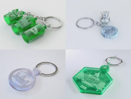 3d render of a graduation commemorative keychain, made of recycled pet plastic from waste bottles, 3d printed in the shape of a university landmark, laser engraved with student id and name, with xiaolu yoyo cartoon pendant, minimalist trendy design, soft lighting, octane render, 8k, ultra detailed, white background, product photography