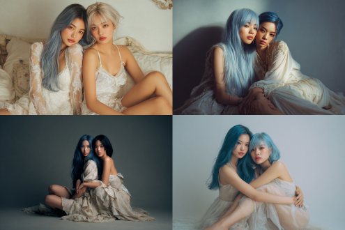 两个东亚超模，一个长发一个短发，全身照，俩人相拥环抱而坐，很有活力，蓝色头发，浅色连衣裙，妆造精美，大长腿，皮肤白皙有质感。