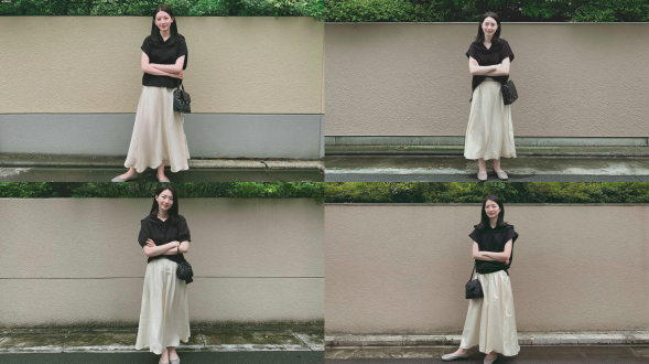 时尚杂志风格人像摄影，一名20-22岁，优雅婉约的东亚少女，嘴角微扬露出柔和浅笑，中等长度的直黑发，双臂交叉，身着黑色兜帽短袖上衣，搭配飘逸的白色及膝裙，脚踩浅灰色平底鞋，手臂上挎一只小巧黑色绗缝手袋；背景为肌理感 beige 砂灰外墙，墙头上方绿意盎然的灌木丛，湿漉漉的混凝土路面；光线为柔和的阴天自然光；呈现日常休闲穿搭的快拍风格，肌肤质感真实细腻，整体色调柔和低饱和，无强烈阴影，洋溢着宁静夏日氛围。避免 ai 美女脸、低质量、模糊、扭曲、多余肢体、多余手指、畸形特征、过度、不足、噪点、粗糙皮肤、肤色暗沉、表情僵硬、过度平滑、塑料质感、水印、文字、边框、过度精修、塑料皮肤、暗沉肤色、明显痘印、明显皱纹、斑点、面部变形。