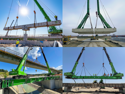 两台绿色的吊车，一起起吊一条30m长的混凝土箱梁，两个吊车各吊箱梁的一头，在往一座桥上架设安装